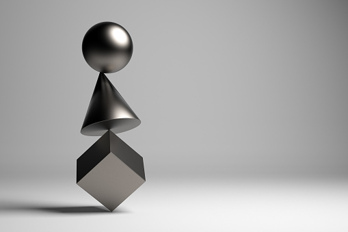 Metallic geometric pieces balancing. Balance concept