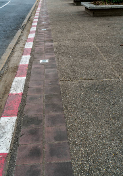 istock Red and white concrete road curb 872112628