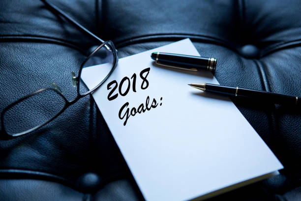 istock 2018 goals written on white paper 872114964