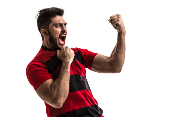 istock Fan / Sport Player on red and black uniform celebrating on white background 872119824