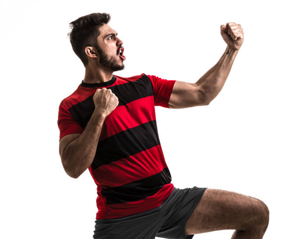istock Fan / Sport Player on red and black uniform celebrating on white background 872119866