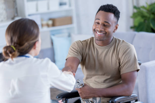 istock Young military officer thanks therapist for help with PTSD 872120582