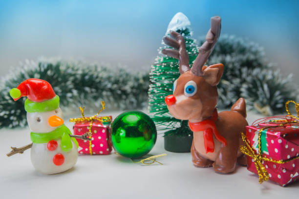 istock snowman and reindeer ready for christmas background 872121840
