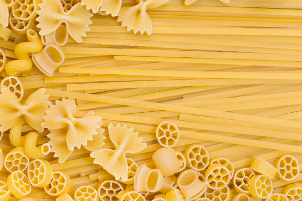 istock Raw pasta background close up 872124648