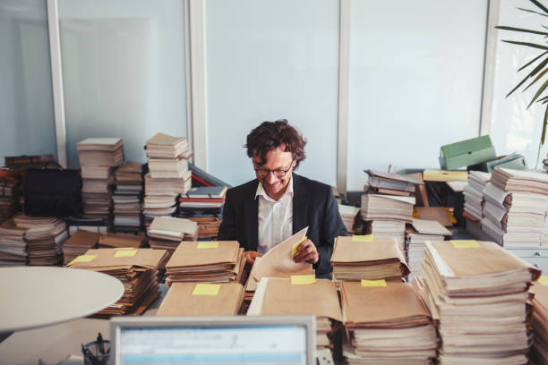 Messy office environment, archives Messy office environment, archives. overworked funny stock pictures, royalty-free photos & images