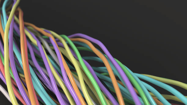 istock Twisted multicolored cables and wires on black surface 872129186