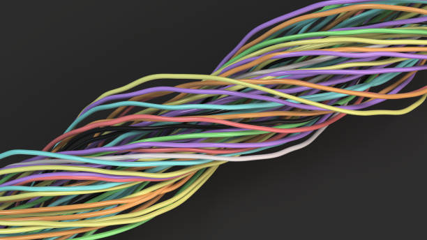 istock Twisted multicolored cables and wires on black surface 872131466