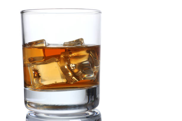 istock Whiskey with ice in a glass isolated 872131818