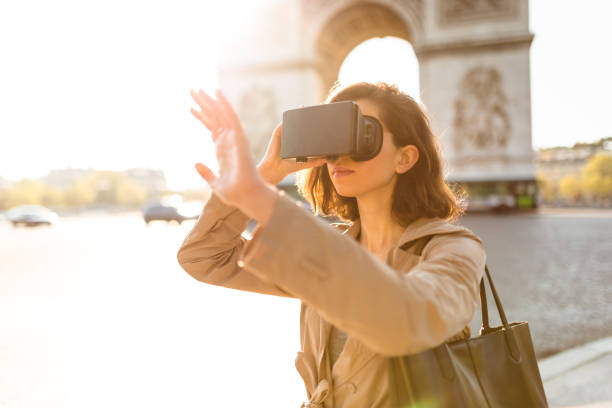 istock tourist woman using a virtual reality device in paris 872132384