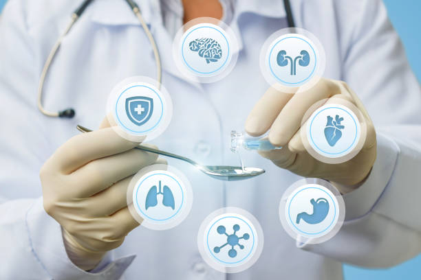 istock Doctor pours medicine for treatment . 872134782