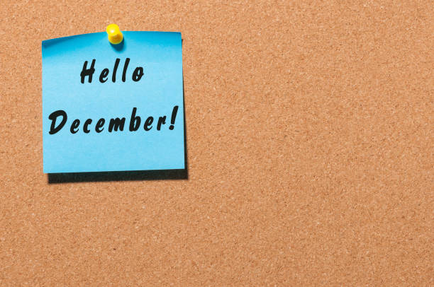 istock Hello December written on blue paper pinned at cork notice board with empty space for text. Eve, Christmas and New year time concept 872134868