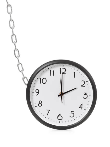 istock Chain holding an alarm wall clock, time management concept 872138666