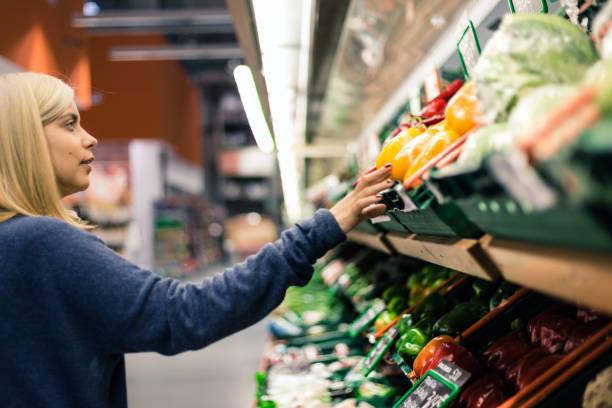 istock Charming woman in supermarket 872139702