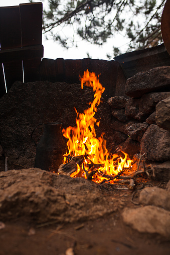 A campfire is a fire at a campsite that provides light and warmth, and heat for cooking. It can also serve as a beacon, and an insect and predator deterrent. Established campgrounds often provide a stone or steel fire ring for safety. Campfires are a popular feature of camping.