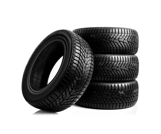 Winter car tires. Group of tires for winter driving on a white background.
