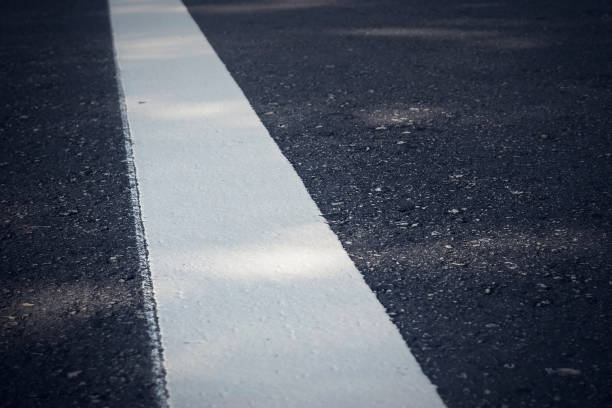 istock white line on new road. 872146392