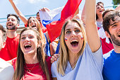 Russian supporters celebrating at stadium with flags