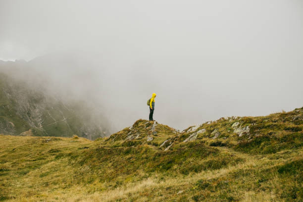 istock Man in Giau Pass, Italy during autumn. 872146912