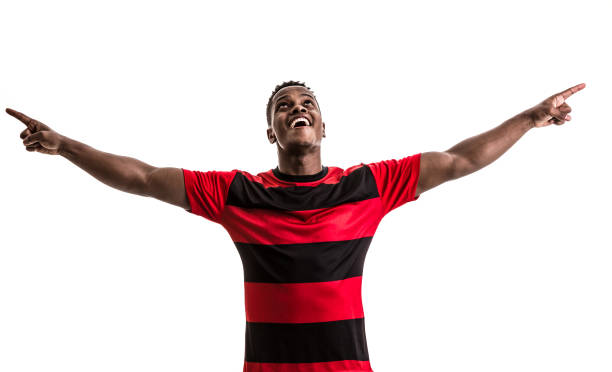 istock Fan / Sport Player on red and black uniform celebrating on white background 872153880