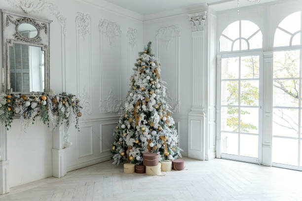 istock Christmas tree with white and gold decorations 872154200
