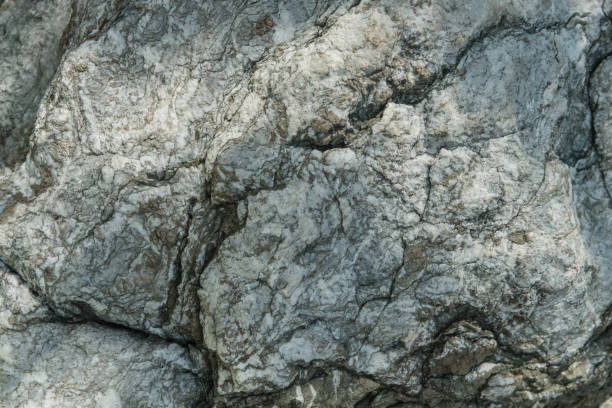 istock Aged gray stone macro, granite texture closeup 872155954