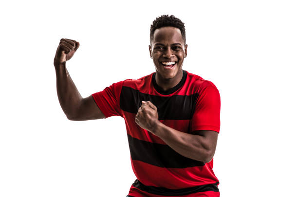 istock Fan / Sport Player on red and black uniform celebrating on white background 872156532