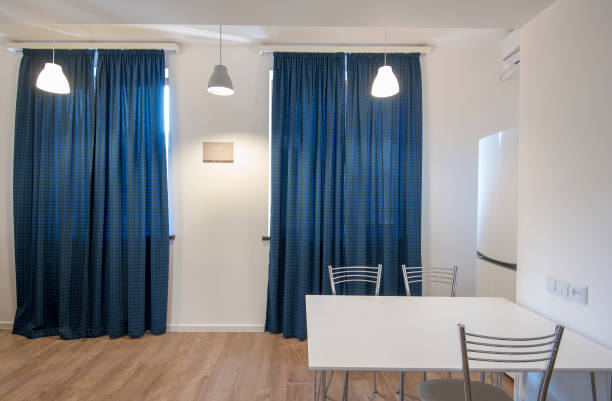 istock Kitchen interior with fridge and table, new modern dining room interior 872156576