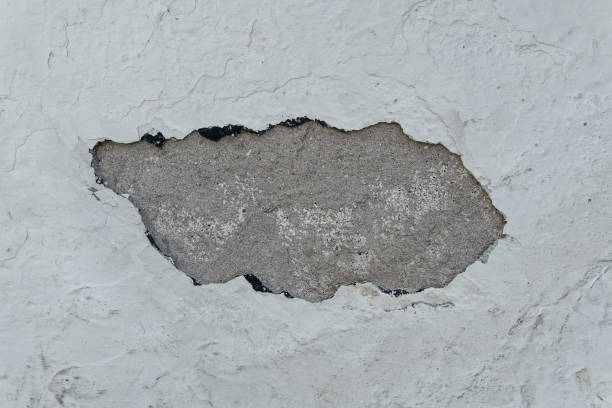 istock Chipped cement plaster, wall texture closeup 872159076