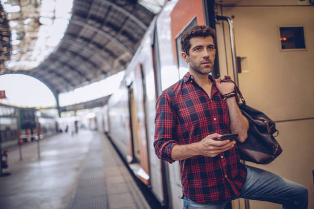 istock Hipster man at station 872159854
