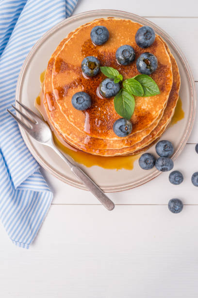istock Stack of pancakes with fresh blueberry and caramel syrup 872162622
