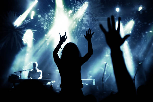 istock new Year concept - cheering crowd and fireworks 872163848