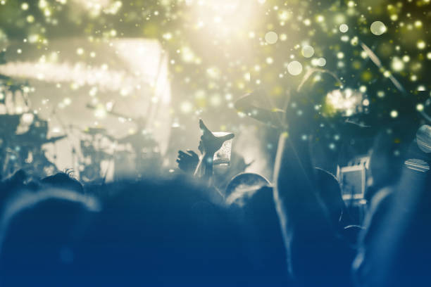 istock new Year concept - cheering crowd and fireworks 872163878