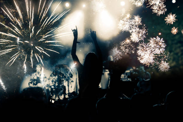 istock new Year concept - cheering crowd and fireworks 872163970