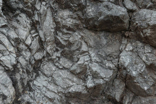 istock Aged gray stone macro, granite texture closeup 872167080