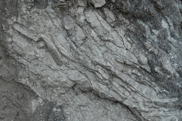istock Aged gray stone macro, granite texture closeup 872167232