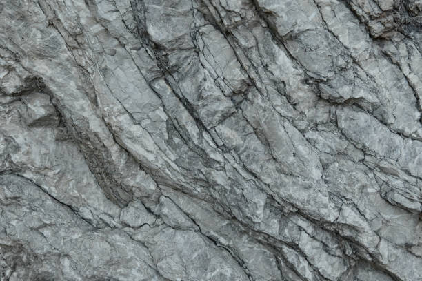 istock Aged gray stone macro, granite texture closeup 872167304