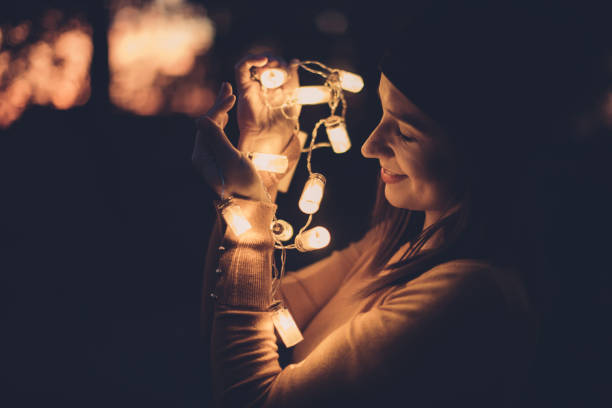 istock Beautiful woman with light 872167630