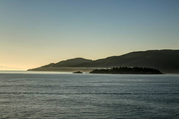 istock fog bank surrounding an island 872170476