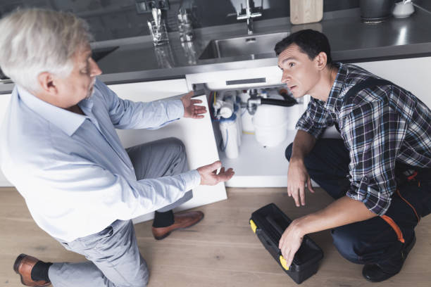 istock A man plumber speaks with a client who is dissatisfied with the work done. 872170890