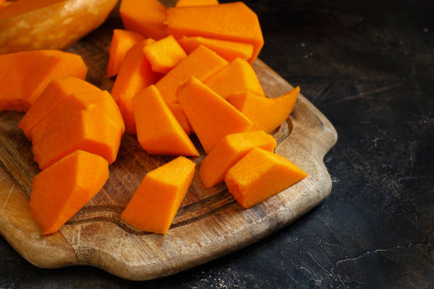 istock Pumpkin slices on a dark  background 872174582