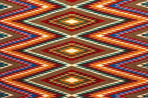 An example of a colorful traditional Navajo textile design, USA.