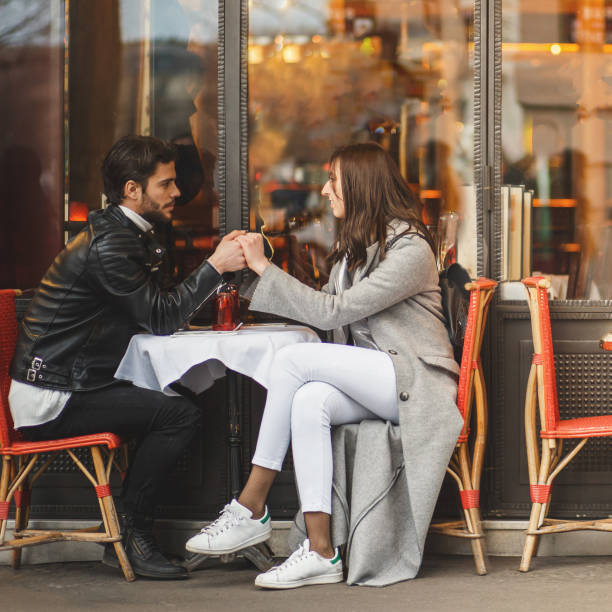 istock Intimate moment in a French cafe 872178450