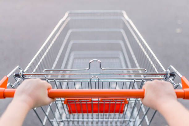 istock Shopper Pushes a Cart in Supermarket 872187066