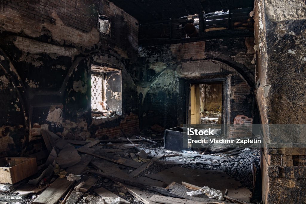 Burned interior of the old historical mansion in Astrakhan Burned interior of the old historical mansion in Astrakhan. Indoors Stock Photo