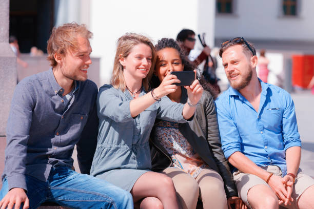 istock Young multiracial friends making selfie 872188008