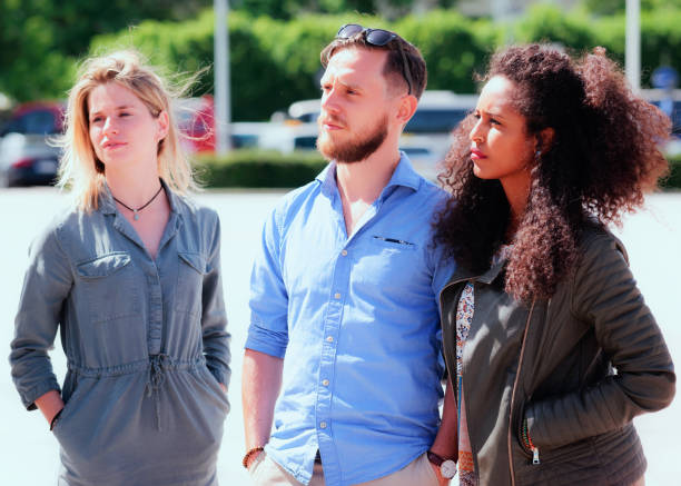 istock Young multiracial friends when looking serious 872188026