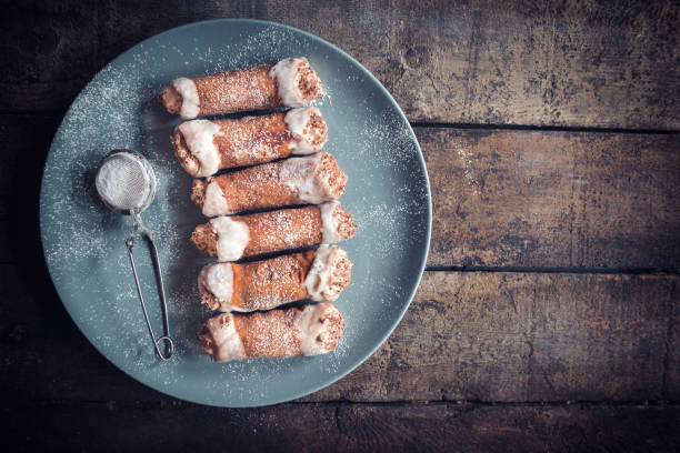 Sweet homemade cannoli with chocolate and vanilla cream