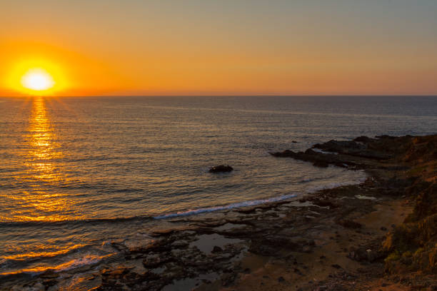 istock Sunset at a rocky beach in Pomos, Cyprus 872191678