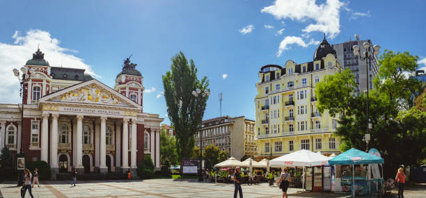 Sofia, Bulgaria - September 12, 2017: People walk through the square in front of National Theater Ivan Vazov - the oldest and most authoritative theatre and one of the important landmarks of Sofia