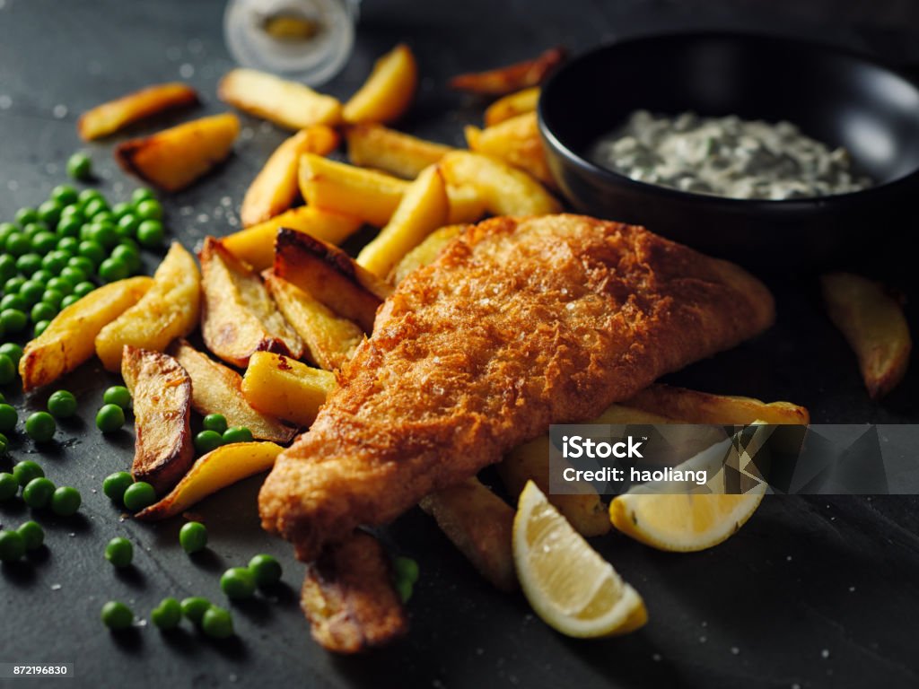 Fish and chips home made Traditional British Dish fish and chips with tartar sauce Fish and Chips Stock Photo